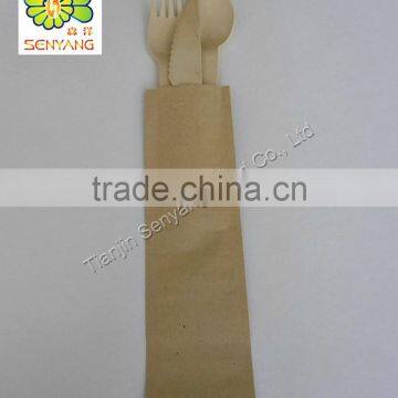 wood spoon wood fork wood knife with a napkin