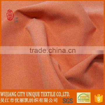 beautiful light orange 100% polyester microfiber peach skin fabric for dress