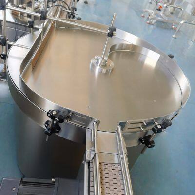 Variable Speed Rotary Unscrambler with Reversible Rotation for Bottle Orienting