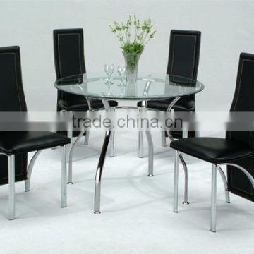 Glass round dining table and black dining chairs