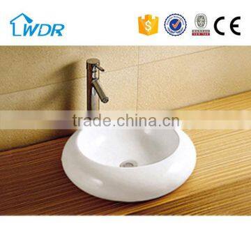 yellow painting design round commercial rest room basin