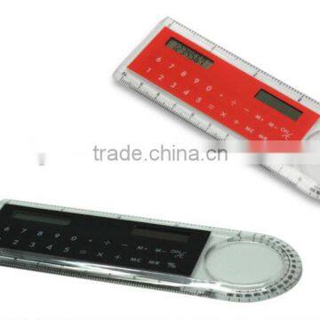 Calculator with ruler and magnifier