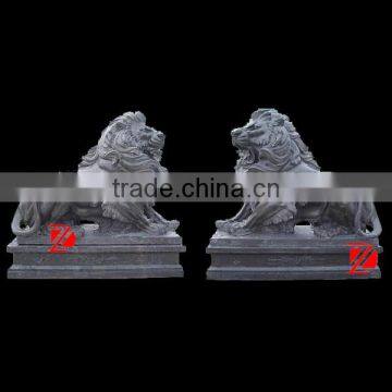 a pair of outdoor black marble lion sculpture