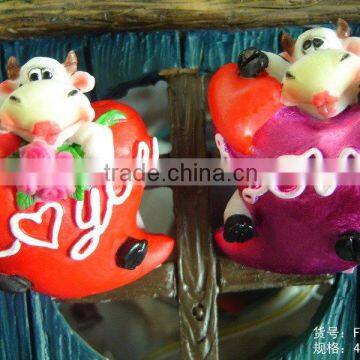 Poly resin cow with heart