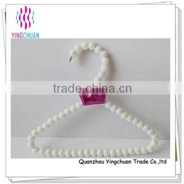 Plastic white bead baby clothes hanger