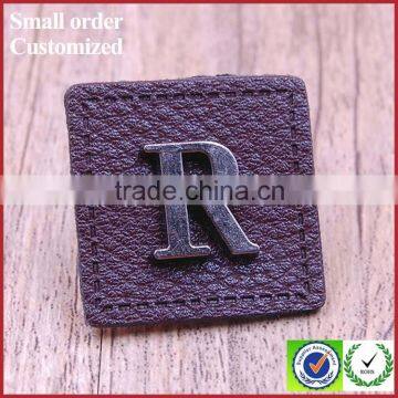 Design custom metal casting beanies jeans bags leather patch labels