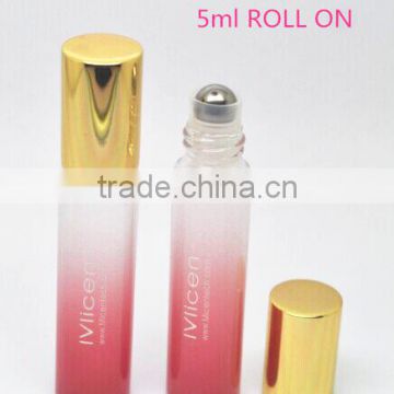 5ml skincare oil roll on glass vial with metal roller ball and shiny golden cap