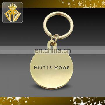 Shiny Brass Mister.Woof Keychain