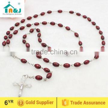 Dark brown oval wooden bead Jesus rosary