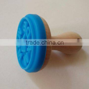 interesting silicone cookie stamp with wooden handle