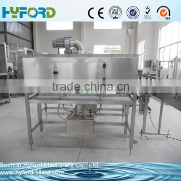 Automatic labeling machine with shrink tunnel and steam generator