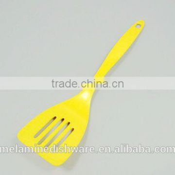 Yellow melamine spoon kitchenware cookware