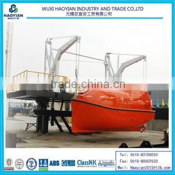 Gravity luffing arm type davit