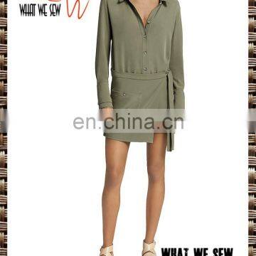 Partial front button placket, attached faux-wrap skirt detail with self-tie sash