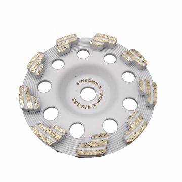 Diamond grinding cup wheel on concrete floor of arrow section