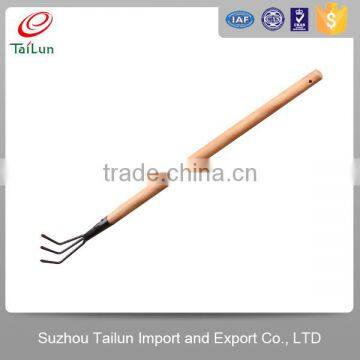 3 Tine garden claw rake with wooden hanle