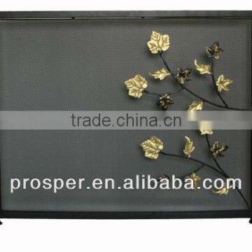 metal fireplace screen with flower pattern