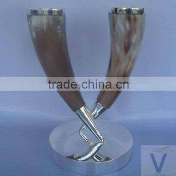 Natural brown buffalo horn candle holder with silver plated base and top. 20cm H