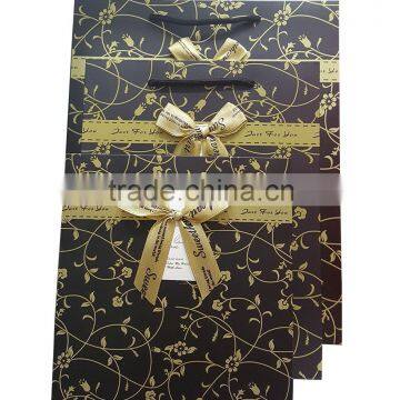 Paper gift bag with ribbon bow