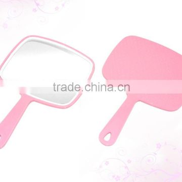 Single sided hand held mirror