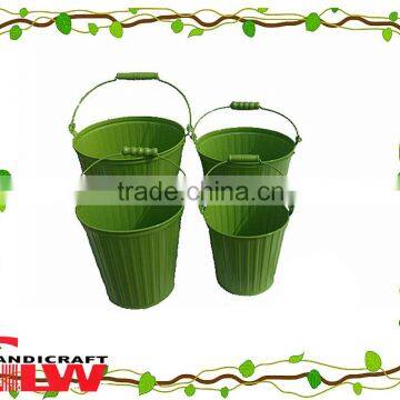 set of 4 handmade and durable, circular shaped home storage buckets with handle and pattern in green color