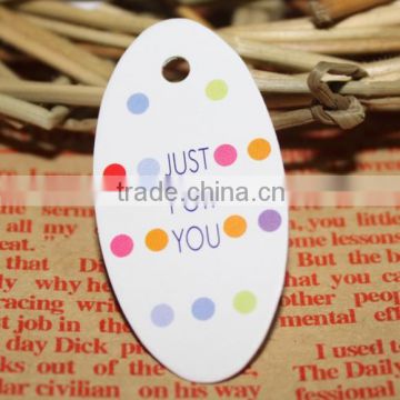 custom 2" x 3.5" Oval Hang Tags with your company logo on it