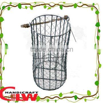 Rustic Garden iron frame lantern with willow foldable handle and glass bottle