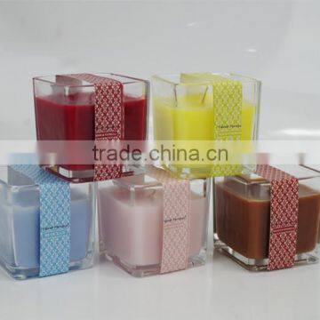 531 colored and scented square glass candle with colored paper bandrole wrapped