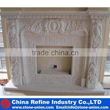 Traditional carved stone fireplace mantel surround