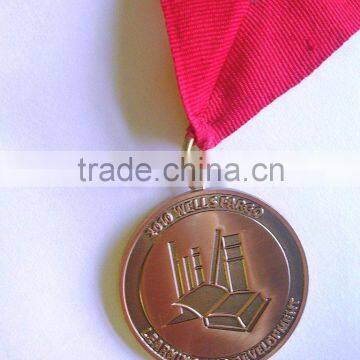 Metal gift medal with red ribbon