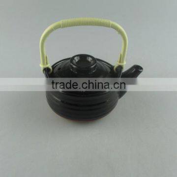 black-glazed ceramic mini teapot with plastic handle