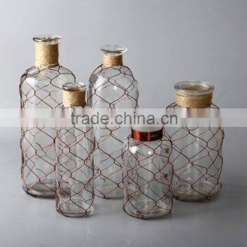 glass bottles with wire and decoration