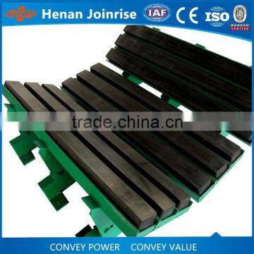 Impact bed for conveyor