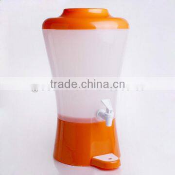 orange plastic juice dispenser with fire hydrant