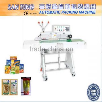 Continuous plastic bag heat sealer