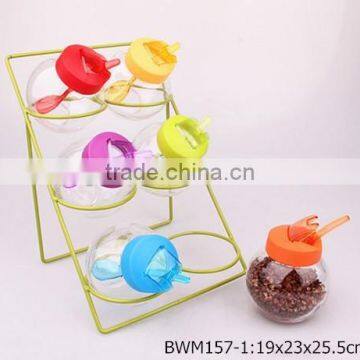 6pcs Round Glass Spice Jars With Plastic Lid and Spoon on a Metal Rack