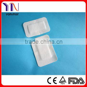 Nonwoven adhesive dressing pad