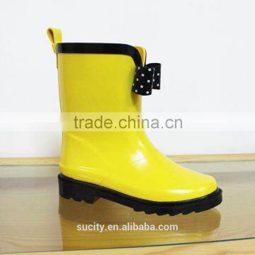 yellow cool kids rubber rain boots with bow