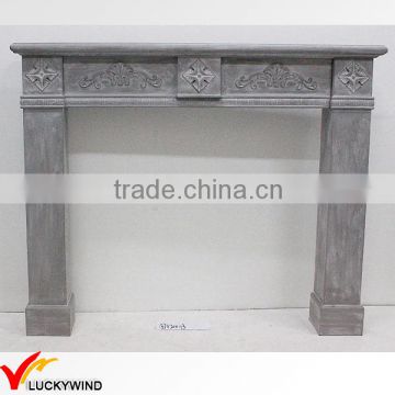 Shabby chic grey wooden fireplace