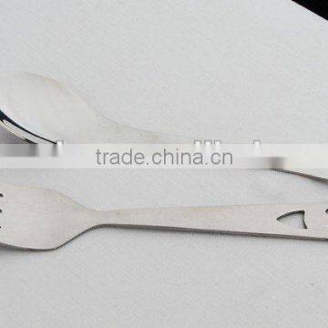 German children carton spoon and fork wiht smile patterns on handle