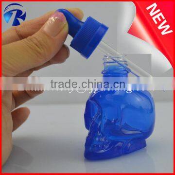 empty unique shaped blue unique skull shaped essential oil glass dropper bottles with pipette