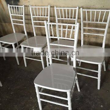 white wood tiffany chair for outdoor grass or beach wedding with white seat pad