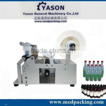 Semi-automatic round bottle glue labeling machine LT-50