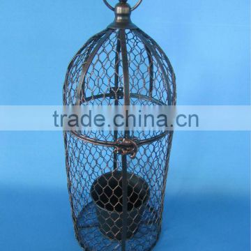 Metal cage planter with lock and zinc pot inside