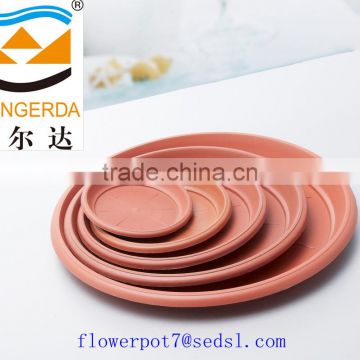 round terracotta plant saucer