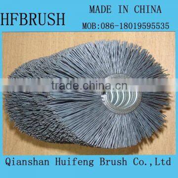 Spiral abrasive brush roller