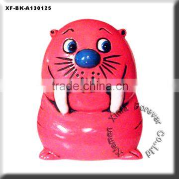 beautiful red ceramic walrus money banks