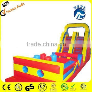 red and yellow inflatable obstacle with slide