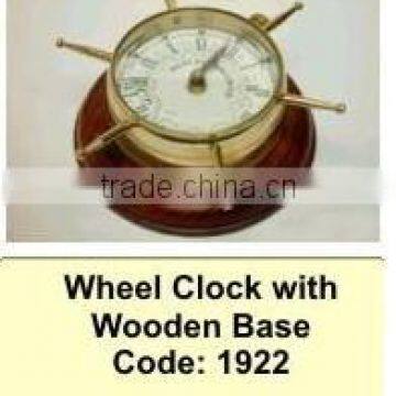 wheel clock on wooden base