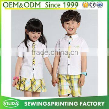 Hot Selling Kindergarten Uniform New Fashion Primary School Uniform White Shirt and Yellow Checked Shorts or Skirt photo-3